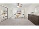 Spacious main bedroom with a ceiling fan, neutral paint, walk-in closet, and carpeted floor at 1285 Aberdeen Dr, Broomfield, CO 80020