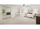 Airy main bedroom boasts a ceiling fan, multiple closets, and neutral paint at 1285 Aberdeen Dr, Broomfield, CO 80020