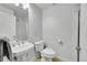 Modern bathroom with sleek fixtures including a pedestal sink and frameless glass shower, offering a clean aesthetic at 290 W 12Th Ave # 205, Denver, CO 80204