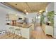 Stylish kitchen with granite countertops, a breakfast bar, and modern appliances at 290 W 12Th Ave # 205, Denver, CO 80204
