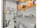 Functional laundry room with modern washer and dryer, shelving for storage, and visible plumbing at 290 W 12Th Ave # 205, Denver, CO 80204