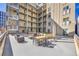Outdoor patio with seating arrangements offering space for dining and relaxation with building views at 290 W 12Th Ave # 205, Denver, CO 80204