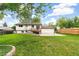 Spacious backyard with a deck, a patio, and a well-manicured lawn provides the perfect outdoor space at 7503 Saulsbury St, Arvada, CO 80003