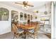 Elegant dining room with a mirrored wall, creating a bright and spacious ambiance for entertaining at 7503 Saulsbury St, Arvada, CO 80003