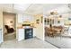 Open kitchen with seamless access to dining and living areas, promoting an inclusive living experience at 7503 Saulsbury St, Arvada, CO 80003
