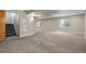Spacious finished basement with gray carpeting, recessed lighting, and two windows for natural light at 1757 Baguette Dr, Castle Rock, CO 80108