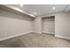 Finished basement area with neutral walls and cozy carpet at 1757 Baguette Dr, Castle Rock, CO 80108