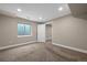 Finished basement area with neutral walls, carpet, and a window at 1757 Baguette Dr, Castle Rock, CO 80108