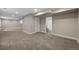 Bright basement showcasing neutral walls, carpet flooring, and recessed lighting at 1757 Baguette Dr, Castle Rock, CO 80108