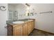 Bright bathroom with double vanity, framed mirrors, and a glass-enclosed shower at 1757 Baguette Dr, Castle Rock, CO 80108