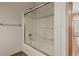 Clean bathroom with a sliding glass door covering the bath/shower and a view to the hallway at 1757 Baguette Dr, Castle Rock, CO 80108