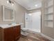 Beautiful bathroom featuring wood-look flooring, shower, vanity, and shelving at 1757 Baguette Dr, Castle Rock, CO 80108