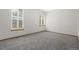 Bedroom with plush carpet and large windows with natural light at 1757 Baguette Dr, Castle Rock, CO 80108