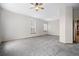 Large bedroom features a ceiling fan and windows with natural light at 1757 Baguette Dr, Castle Rock, CO 80108