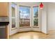 Cozy dining area with bay windows offering a view of the outdoors at 1757 Baguette Dr, Castle Rock, CO 80108