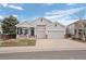 Charming single-Gathering home with a welcoming front porch and a well-maintained, green lawn at 1757 Baguette Dr, Castle Rock, CO 80108