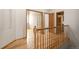 Hallway with hardwood floors and wood railing at 1757 Baguette Dr, Castle Rock, CO 80108