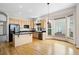 Eat-in kitchen featuring wood cabinets, black appliances, and large windows at 1757 Baguette Dr, Castle Rock, CO 80108