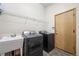 Functional laundry area equipped with modern washer and dryer at 1757 Baguette Dr, Castle Rock, CO 80108