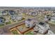 An aerial view of a modern home in a well-planned neighborhood, with a fenced yard and solar panels at 9479 Rifle St, Commerce City, CO 80022
