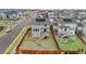 The backyard features a deck with stairs leading down to a fenced-in yard with a stone fire pit at 9479 Rifle St, Commerce City, CO 80022