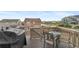 Outdoor deck area with a grill and patio furniture, offering a relaxing outdoor living space at 9479 Rifle St, Commerce City, CO 80022