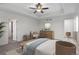 Spacious main bedroom with a ceiling fan and comfortable furnishings at 9479 Rifle St, Commerce City, CO 80022