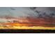 Striking sunset view over the houses and mountains, creating a picturesque and serene backdrop at 9479 Rifle St, Commerce City, CO 80022