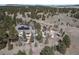 Aerial view of a home showcasing a spacious yard and serene wooded surroundings, perfect for outdoor recreation and relaxation at 19375 Sherwood Trl, Monument, CO 80132