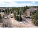 Aerial view of a home showcasing a sprawling yard and serene wooded surroundings, offering privacy and tranquility at 19375 Sherwood Trl, Monument, CO 80132