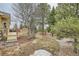 Backyard features a wood deck, steps down to a natural setting perfect for outdoor enjoyment and recreation at 19375 Sherwood Trl, Monument, CO 80132