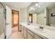 Bright bathroom with double sinks, a large mirror, and access to the toilet and shower at 19375 Sherwood Trl, Monument, CO 80132