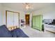 Cozy bedroom with neutral carpet, bright white trim, and ceiling fan with light at 19375 Sherwood Trl, Monument, CO 80132