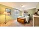 Cozy bedroom with a comfortable bed, a cedar chest, and natural light from the window at 19375 Sherwood Trl, Monument, CO 80132