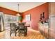 Dining room features modern pendant lighting and a sliding door to the outdoor patio at 19375 Sherwood Trl, Monument, CO 80132