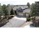Beautiful home featuring a three-car garage, mature trees, and a well maintained lawn at 19375 Sherwood Trl, Monument, CO 80132