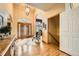 Grand foyer featuring hardwood floors and an arched doorway at 19375 Sherwood Trl, Monument, CO 80132