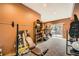 Spacious home gym featuring a weight rack, exercise equipment, and access to the outdoors at 19375 Sherwood Trl, Monument, CO 80132
