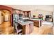 Spacious open kitchen with stainless steel appliances, granite countertops, and hardwood flooring at 19375 Sherwood Trl, Monument, CO 80132