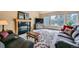 Cozy living room featuring a fireplace, large windows, and comfortable seating at 19375 Sherwood Trl, Monument, CO 80132
