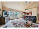 Bright living room with vaulted ceiling, lots of natural light, and an open floor plan at 19375 Sherwood Trl, Monument, CO 80132