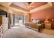 Bright main bedroom with unique ceiling design, access to a private deck, and lots of light at 19375 Sherwood Trl, Monument, CO 80132