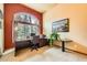 Bright home office with large arched window, custom desk, and professional decor at 19375 Sherwood Trl, Monument, CO 80132