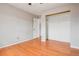 This bedroom features hardwood floors, a neutral color palette, and a large closet at 925 Elm St, Denver, CO 80220