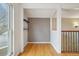 Bright bonus room with hardwood floors and two display shelves offers versatile space at 925 Elm St, Denver, CO 80220