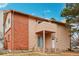 Charming two-story with brick facade, private balcony, and inviting front entrance at 925 Elm St, Denver, CO 80220