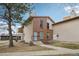 Inviting two-story townhouse with a brick facade and manicured yard at 925 Elm St, Denver, CO 80220