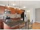 Bright kitchen with stainless steel appliances and dark granite countertops at 925 Elm St, Denver, CO 80220