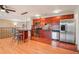 Kitchen with stainless steel appliances and beautiful wooden cabinets at 925 Elm St, Denver, CO 80220