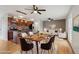 Open-concept living space with wood floors, kitchen, dining area, and living room at 925 Elm St, Denver, CO 80220